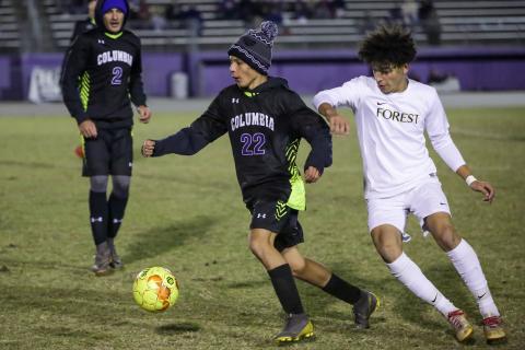 Columbia's Jason Caballero dribbles around Forest player on Tuesday night. The Tigers and Wildcats will face each other in the District 2-6A quarterfinals on Feb. 3. (BRENT KUYKENDALL/Lake City Reporter)