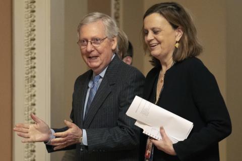 Senate Majority Leader Mitch McConnell, R-Ky., accompanied by his chief of staff, Sharon Soderstrom, after the Senate voted to not allow witnesses in the impeachment trial of President Donald Trump. (AP PHOTO)