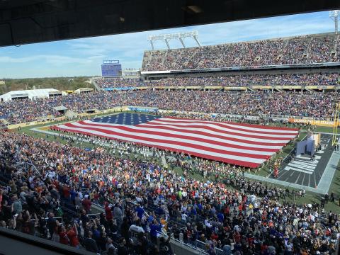 An American flag is stretched across the field at Camping World Stadium for the national anthem at the Pro Bowl on Sunday, in Orlando. (MICHAEL BJORKLUND-MALCOM/Special to the Reporter)