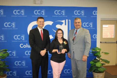 Steve Nelson (from left), Columbia School Board chairman poses with Candace Starling and Lex Carswell, Columbia Schools’ Superintendent after Starling, a CHS secretary, was named the 2020 School-Related Employee of the Year Award winner Thursday. (TONY BRITT/Lake City Reporter)