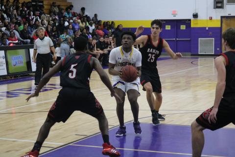 Columbia guard Darrien Jones drives into the lane to take a shot against Baker County on Friday night. (JORDAN KROEGER/Lake City Reporter)