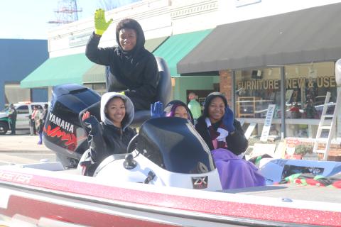 Children atop the Trinity United Methodist Church float wave at the crowd as the float heads down Marion Avenue during Monday’s MLK Jr. parade. (TONY BRITT/Lake City Reporter)