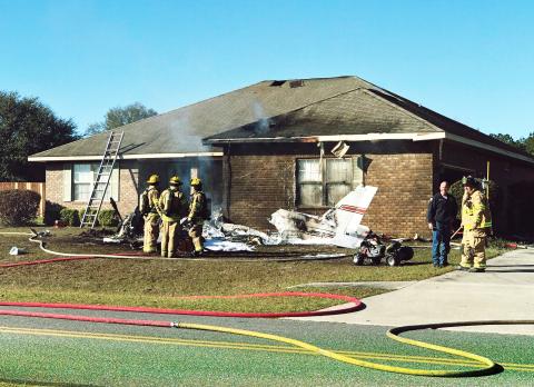 First responders are pictured at the scene of a plane crash at Cannon Creek Airpark Saturday morning. (ROBERT BRIDGES/Lake City Reporter)