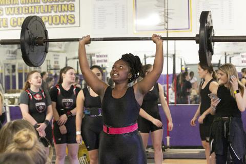 Columbia weightlifter Miracle Rentz-Black finishes her clean and jerk during Thursday’s meet against Santa Fe. (JEN CHASTEEN/Special to the Reporter) 