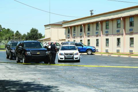 Officers at the scene of a homicide at the Ramada Limited motel on U.S. 90 in 2016. (FILE)