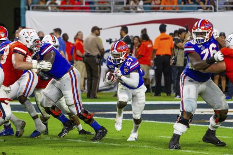Florida running back Dameon Pierce (27) runs for a first down against Virginia during the 2019 Capital One Orange Bowl at Hard Rock Stadium on Monday, in Miami Gardens. (AARON GILBERT/Icon Sportswire via AP)