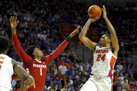 Florida forward Kerry Blackshear Jr. takes a jump shot over Alabama's Herbert Jones (1) during Saturday’s game at the O’Connell Center. (TRIBUNE NEWS SERVICE)