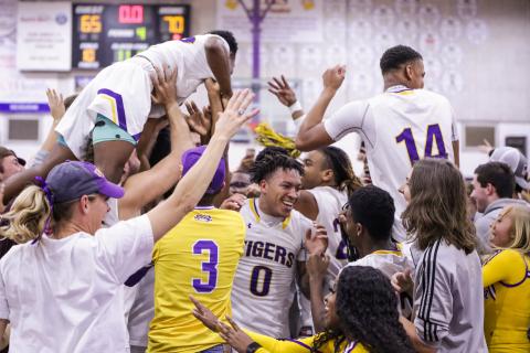 Columbia’s basketball team celebrates with students after defeating Daytona Beach Mainland 70-65 in Friday night’s Region 1-6A final. (BRENT KUYKENDALL/Lake City Reporter)