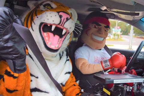 Mascots for Columbia High and Fort White High prepare for the “Battle of the Belts,” a friendly competition organized by FDOT. For its size, Columbia is the worst county in the state for seat-belt use, the agency says. (COURTESY)