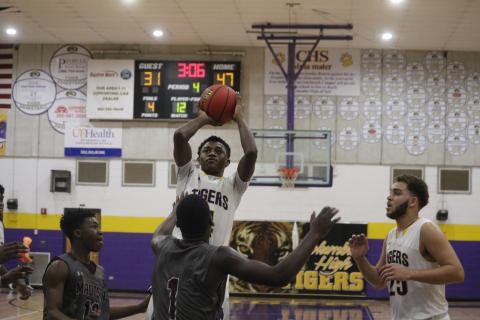 Columbia guard Kenney Gaines pulls up for a shot against Madison County on Friday night. (ZACH ABOLVERDI/Lake City Reporter)