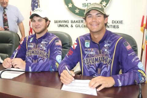 Columbia Bassmasters Jackson Swisher (left) and Seth Slanker (right) signed their letters of intent to compete with Florida Gateway College on Thursday. (TONY BRITT/Lake City Reporter)