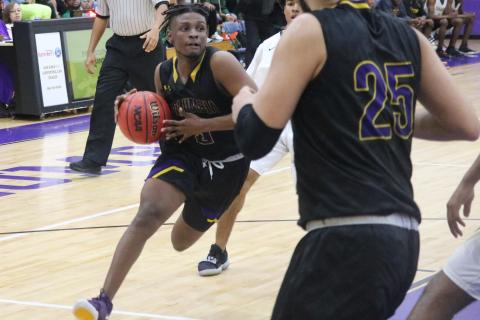 Columbia guard Darrien Jones drives to the basket against Lincoln in the District 2-6A championship on Feb. 15. (JORDAN KROEGER/Lake City Reporter)