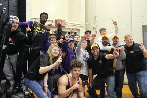 Columbia’s wrestling team celebrates winning the District 2-2A IBT championship on Saturday. (COURTESY)