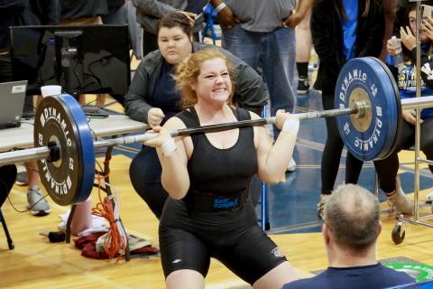 Columbia weightlifter Reece Chasteen lifts the bar during her clean and jerk at the Class 2A state meet on Saturday. (JEN CHASTEEN/Special to the Reporter)