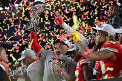 Kansas City Chiefs quarterback Patrick Mahomes holds the Vince Lombardi Trophy after beating the San Francisco 49ers and winning the Super Bowl at Hard Rock Stadium. (JOHN McCALL/South Florida Sun Sentinel/TNS)