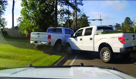 A stolen Dodge Ram pickup, left, is seen after it was spun out and wrecked in Gainesville. (COURTESY CCSO)