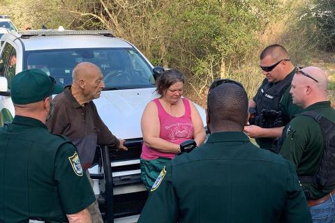 William Richard Grau, 77, the man in civilian garb pictured on the left, and his daughter, Cheryl Grau Articas, 52, pictured to his left, are arrested Tuesday. The investigation began with an anonymous call in December. (Photos courtesy SCSO)