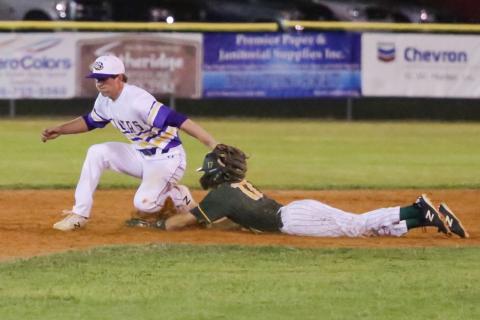 Columbia shortstop Kade Jackson applies the tag late as Forest's Bradley White II slides safely into second base. (BRENT KUYKENDALL/Lake City Reporter)