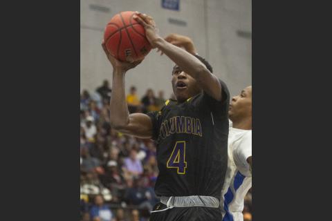 Columbia’s Kenney Gaines (4) goes up for a basket against Dillard during the second half of their Class 6A state semifinal at The RP Funding Center on Thursday, in Lakeland. (MICHAEL WILSON/Special to the Reporter)               