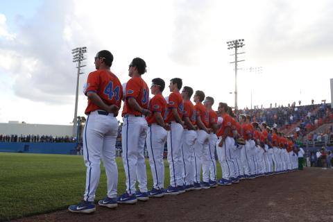 Florida's baseball team stands for the national anthem prior to Tuesday's game against Florida State, in Gainesville. (AAU COMMUNICATIONS)