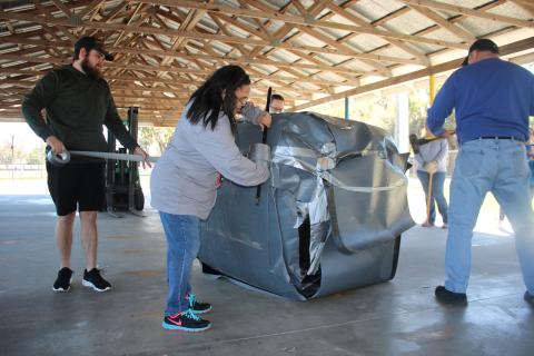 Eastside Parents, students and staff spent hours wrapping tape around what became the heaviest known ball of tape in the world. Beneath the masking tape and duct tape, wide swaths of roofing tape can be seen covering the ball. (AMY HIETT/Special to the Reporter)