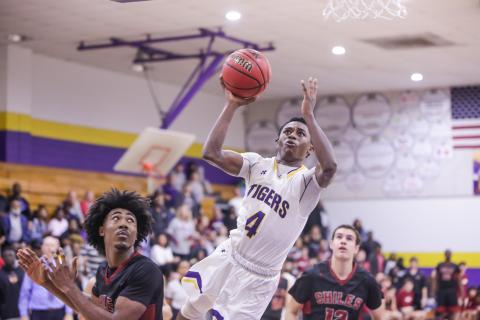 Columbia guard guard Kneney flies toward the basketball to score against Chiles during the Region 1-6A quarterfinals on Feb. 20. (BRENT KUYKENDALL/Lake City Reporter)