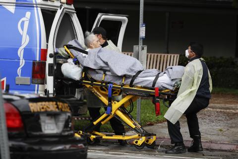 A patient is evacuated from the Magnolia Rehabilitation and Nursing Center in Riverside, Calif., on April 8. More than 80 patients from a Riverside skilled nursing facility are being evacuated this morning to other healthcare locations throughout Riverside County, Calif. (AP PHOTO)