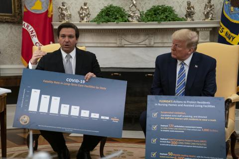 President Donald Trump listens as Gov. Ron DeSantis, R-Fla., talks about the coronavirus response during a meeting in the Oval Office of the White House, Tuesday, in Washington. (EVAN VUCCI/Associated Press))