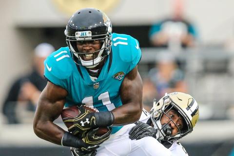 Jacksonville Jaguars wide receiver Marqise Lee (11) catches a pass defended by New Orleans Saints defensive back Patrick Robinson during the first quarter of an NFL preseason football game at TIAA Bank Field on Aug. 9, 2018, in Jacksonville. (TRIBUNE NEWS SERVICE)