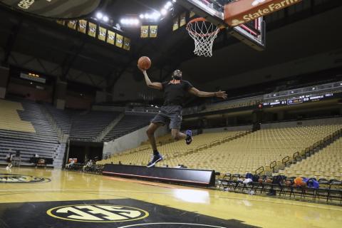 Florida team manager Chris Sutherland is shown warming up before a game between Florida team managers and Missouri team managers, the night before an NCAA college basketball game between Florida and Missouri, at Mizzou Arena in Columbia, Mo. Sutherland waited nearly five years to finally play college basketball. (ALEX DE LA OSA/UAA Communications)