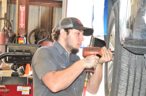 Chris Shillito gets to work at Tire Mart of Lake City in late April. Business was slow then but has since ramped back up as cars return to the road. (CARL MCKINNEY/Lake City Reporter)