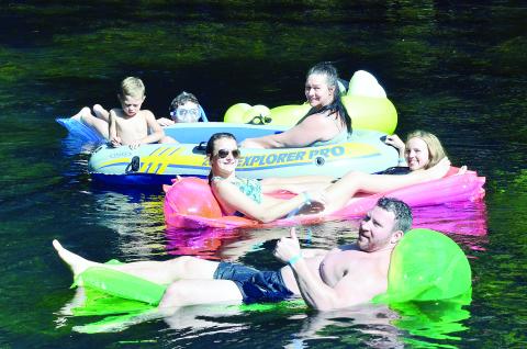 The Scott family floats down the Ichetucknee River in this file photo from the 2016 summer tubing season. Ichetucknee Springs State Park is allowing guests inner tubes, canoes and kayaks back in for some outdoor fun. (CARL MCKINNEY/Lake City Reporter)