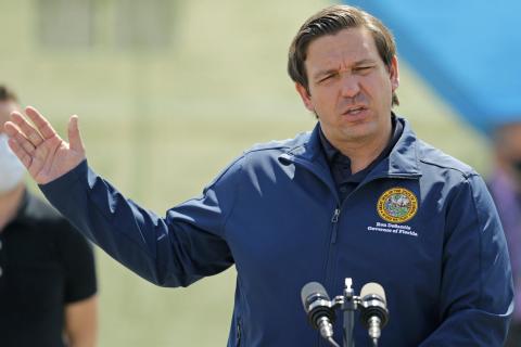 Florida Governor Ron DeSantis talks to the media during press conference to announces covid-19 antibody testing, mobile lab at Hard Rock Stadium as the novel coronavirus pandemic continues on May 6, in Miami Gardens. (DAVID SANTIAGO/Miami Herald/TNS)