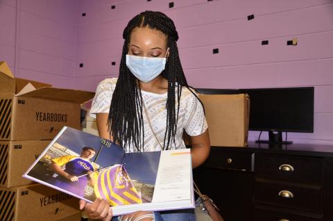 Columbia editor-in-chief Anan-Eya Hardman holds in her hands the culmination of a months-long collaborative effort. (CARL MCKINNEY/Lake City Reporter)