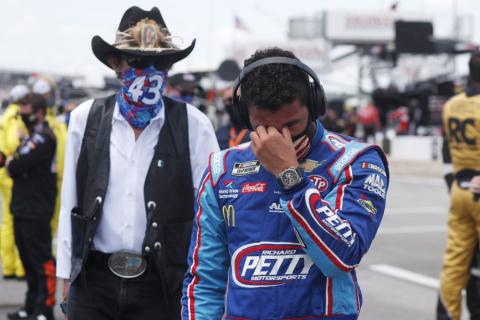Driver Bubba Wallace, right, is overcome with emotion as he and team owner Richard Petty walk to his car in the pits of the Talladega Superspeedway prior to the start of the NASCAR Cup Series auto race at the Talladega Superspeedway on Monday, in Talladega Ala. (JOHN BAZEMORE/AP Photo)