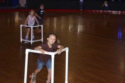 Children skate during a daycare field trip to Skating Palace on Tuesday afternoon. The local skating rink says business is starting to ramp back up, and expects to see an increased volume of customers next week. (CARL MCKINNEY/Lake City Reporter)
