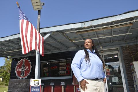 Tiffany Jordan strikes a pose outside a small, rural convenience store in Columbia County. Both Jordan and the store are set to be featured in an upcoming film, which begins shooting in August. (CARL MCKINNEY/Lake City Reporter)