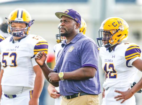 Columbia coach Brian Allen signals in a play against Oakleaf last season. (FILE)