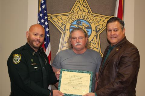 Deputy Anthony Cortese, left, is seen with Jim Osburn and Sheriff Mark Hunter. (COURTESY)
