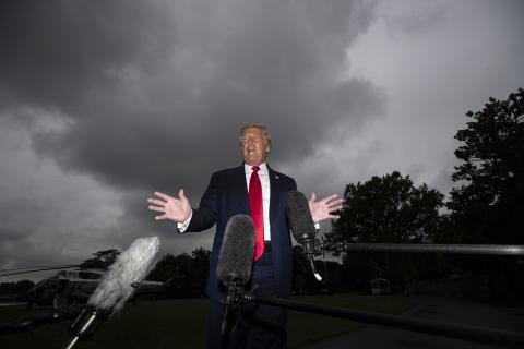 President Donald Trump speaks with reporters before walking to Marine One on the South Lawn of the White House on Friday in Washington. Trump is en route to Florida. (ALEX BRANDON/Associated Press)