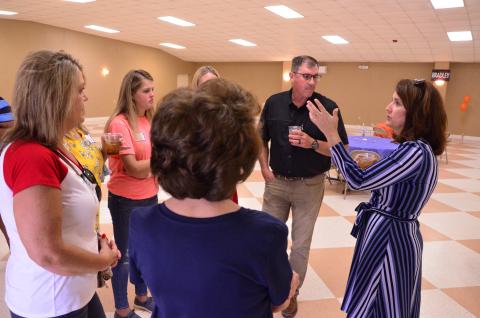 State Senate candidate Jennifer Bradley chats with a group during a meet and greet at the Columbia County Fairgrounds on Thursday. Bradley, a Republican, is running for the District 5 Senate seat held by her soon-to-be term-limited husband. (CARL MCKINNEY/Lake City Reporter)