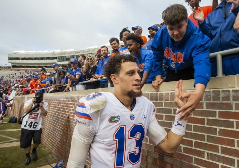 Florida quarterback Feleipe Franks (13) gets congratulated by fans after defeating Florida State 41-14 on Nov. 24, 2018, in Tallahassee. (AP FILE PHOTO)