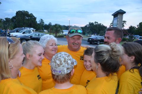 Tim Murphy, center, is congratulated by family members and supporters Tuesday night after winning his re-election bid to the County Commission. (CARL MCKINNEY/Lake City Reporter)