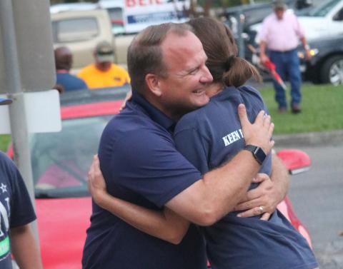 Kyle Keen hugs his wife, Brandi, Tuesday night outside the Supervisor of Elections office after winning the Tax Collector’s primary race. With the win, Keen advances to November’s general election. (JAMIE WACHTER/Lake City Reporter)