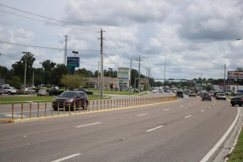 The Florida Department of Transportation will soon replace the traffic delineators near the Lake City Commons shopping center with a raised median. (TONY BRITT/Lake City Reporter)