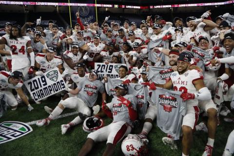 Members of the Miami of Ohio team pose on the field after winning the Mid-American Conference championship against Central Michigan on Dec. 7, 2019, in Detroit. The Mid-American Conference on Saturday became the first league competing at college football’s highest level to cancel its fall season because of covid-19 concerns. (AP FILE PHOTO)