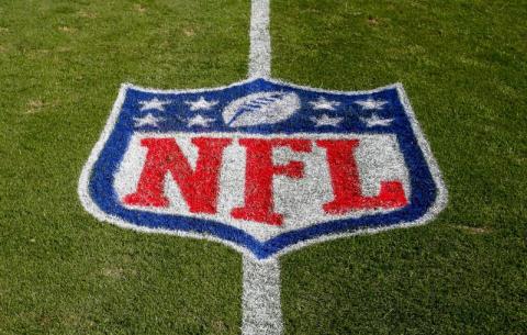 The NFL logo is displayed on the field at the Bank of American Stadium before a game between the Tampa Bay Buccaneers and the Carolina Panthers on Nov. 4, 2018, in Charlotte, N.C. The NFL revealed Sunday, that several positive covid-19 tests were found a day earlier by one of its testing partners, and the Chicago Bears said they had nine false positives. (AP FILE PHOTO)
