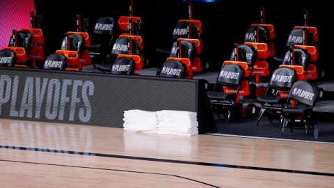 Benches sit empty at game time of a scheduled game between the Milwaukee Bucks and the Orlando Magic for Game 5 of the Eastern Conference first round series at AdventHealth Arena at ESPN Wide World Of Sports Complex on Wednesday, in Lake Buena Vista. (KEVIN C. COX/Getty Images/TNS)