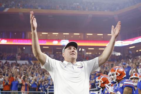Florida head coach Dan Mullen pumps up the crowd prior to the start of the Capital One Orange Bowl against Virginia at Hard Rock Stadium last December. (MICHAEL REAVES/Getty Images/TNS)