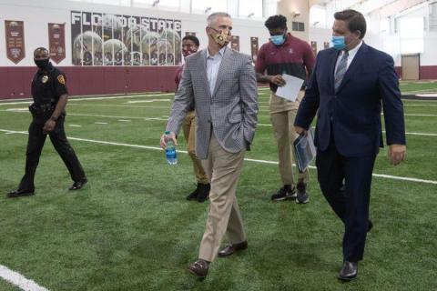 Gov. Ron DeSantis and FSU Head Football Coach Mike Norvell both advocate playing college football this fall. (TORI LYNN SCHNEIDER/Tallahassee Democrat/TNS)